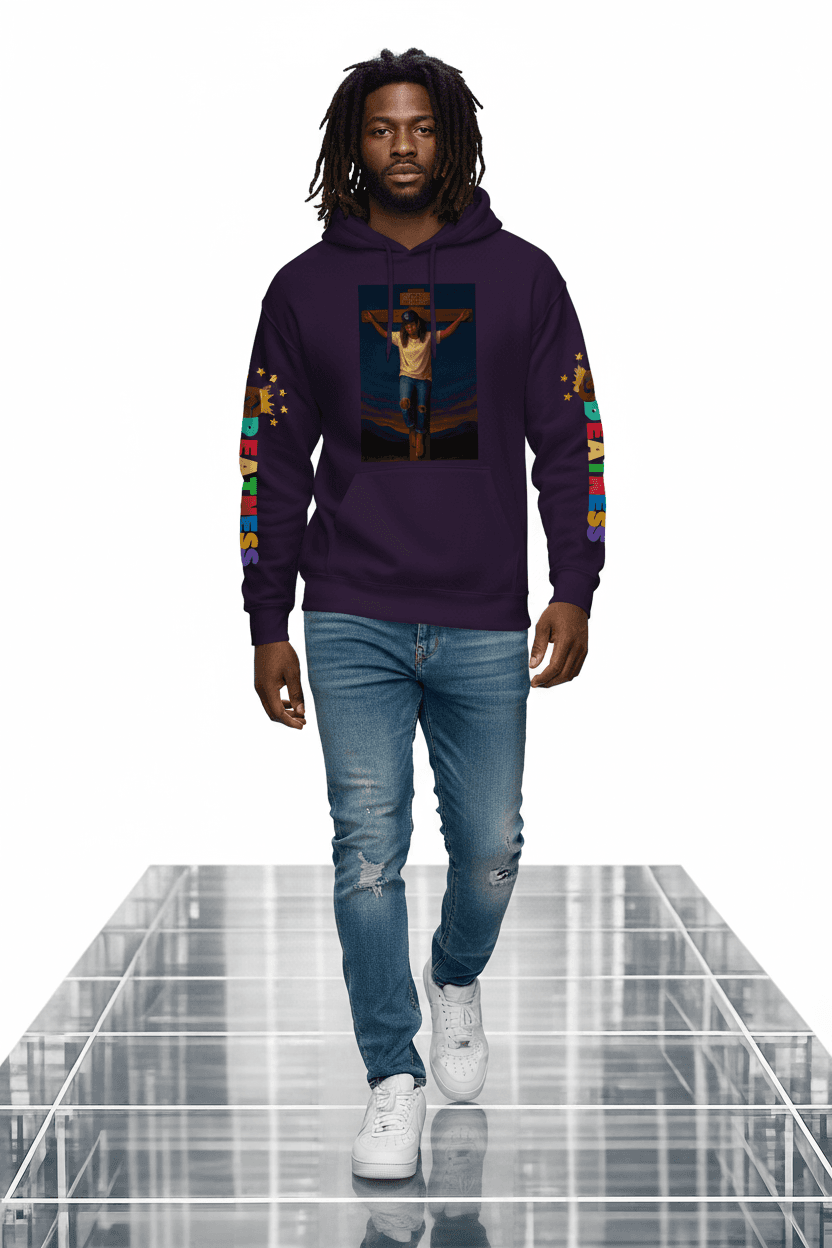 Man wearing a purple graphic hoodie and distressed jeans on a reflective glass runway.